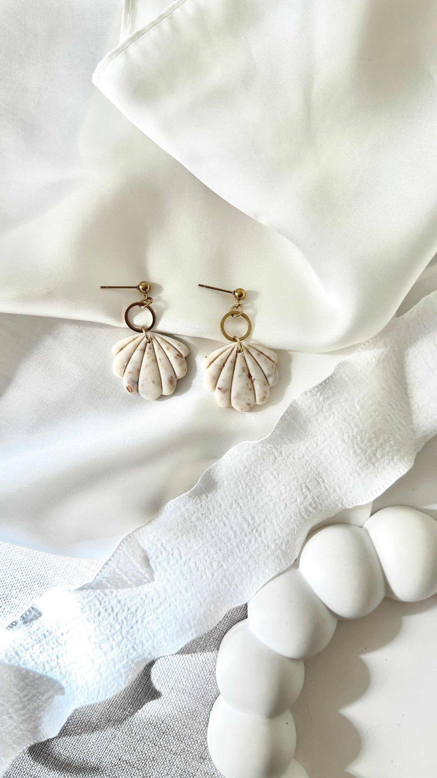 Nerida-korvakorut hiekka